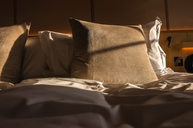 Bamboo pillow vs memory foam pillow side by side — comparing two popular pillow types for neck pain relief and sleep quality
