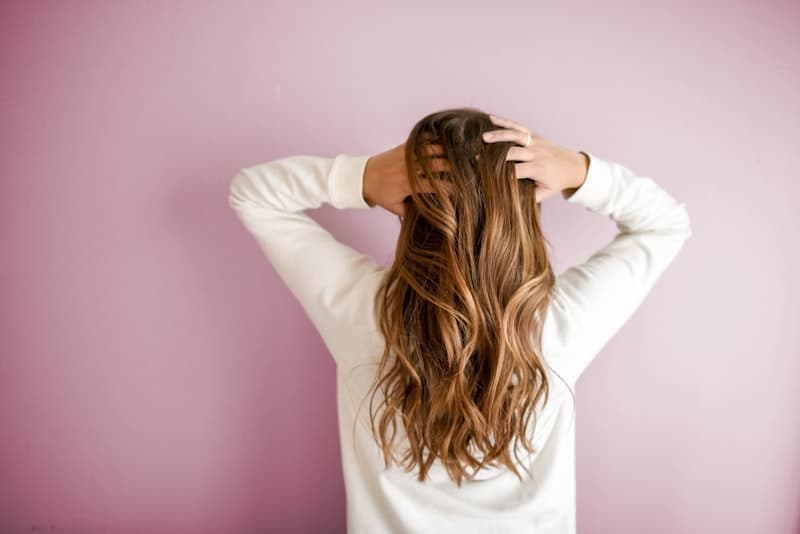 Hair care routine supporting hair strength and nail growth with collagen