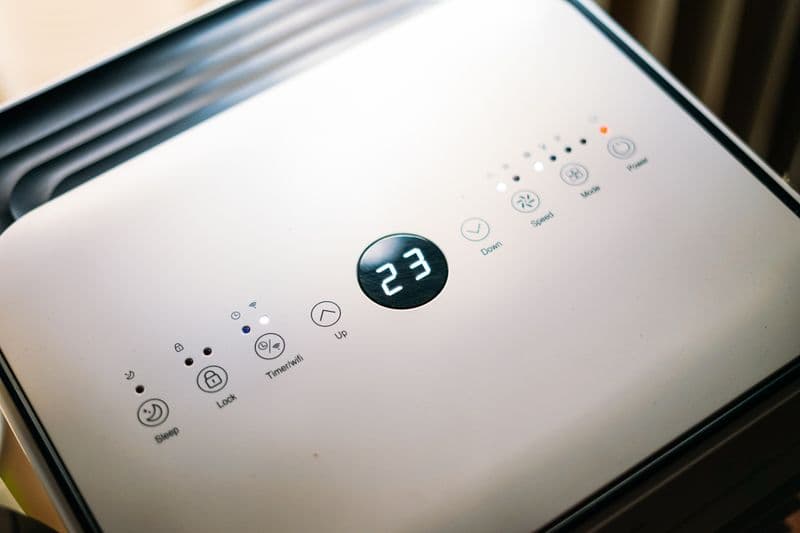 Close-up of an appliance control panel with humidity setting display, the biggest lever for cutting dehumidifier running cost