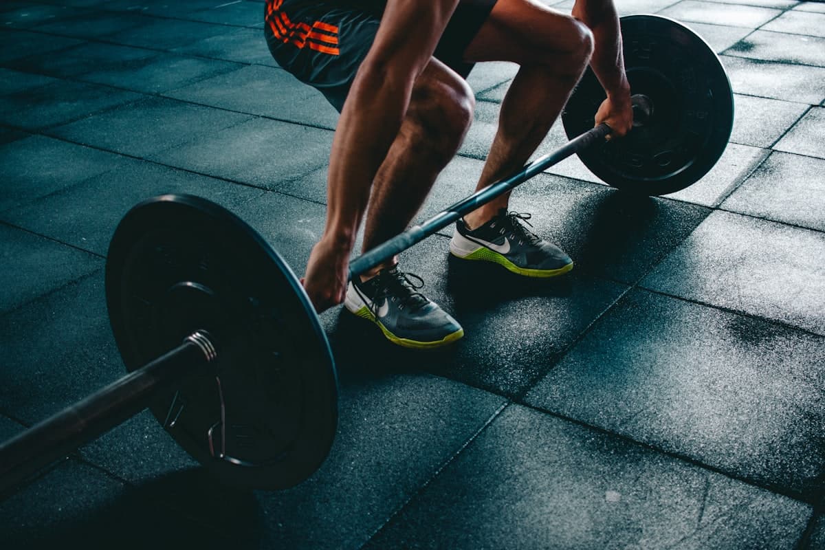 Dumbbell and kettlebell side by side on a home gym mat -- which is better for your workout?