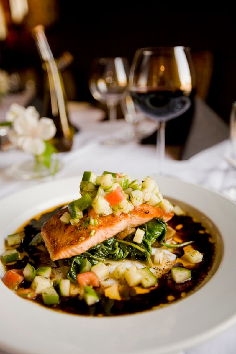Fresh salmon fillet and omega-3 fish oil capsules for health and wellness