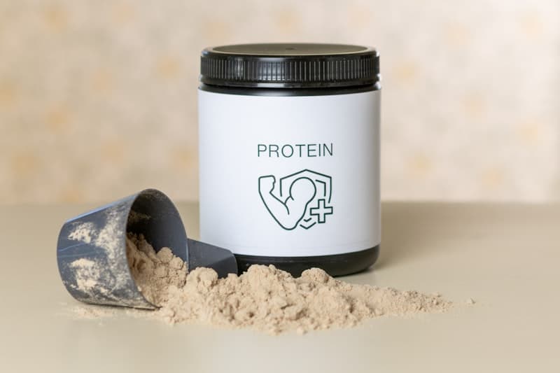 Plant-based protein powder and whey protein powder side by side on a kitchen counter — comparison guide