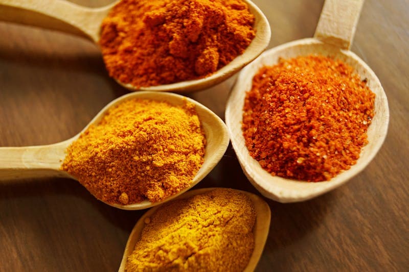 Turmeric root and curcumin supplement capsules side by side -- the real difference explained