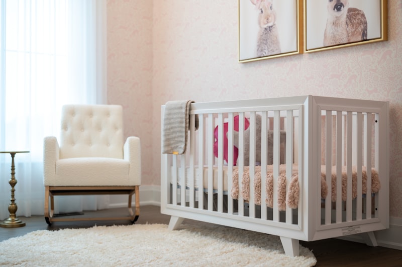 Cozy nursery with white crib and armchair — maintaining ideal humidity and air quality for babies